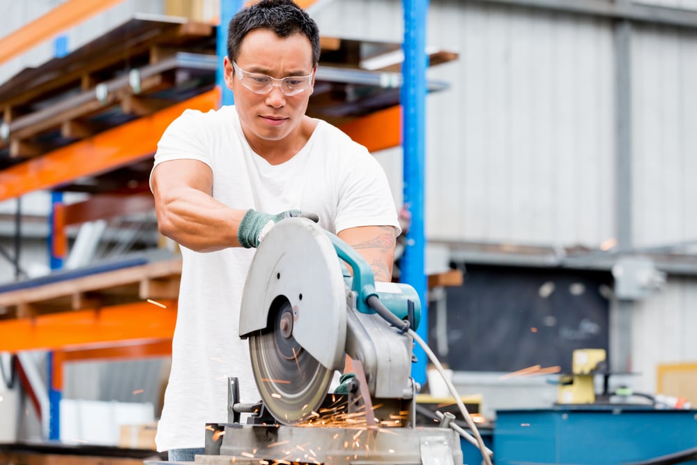 Asian worker in production plant on the factory floor